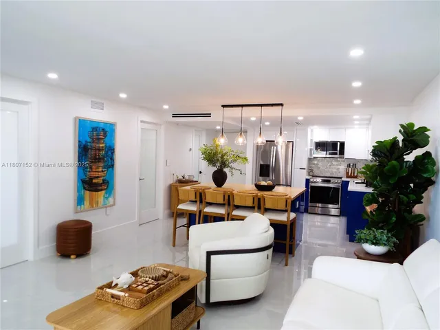 a kitchen with sink and refrigerator