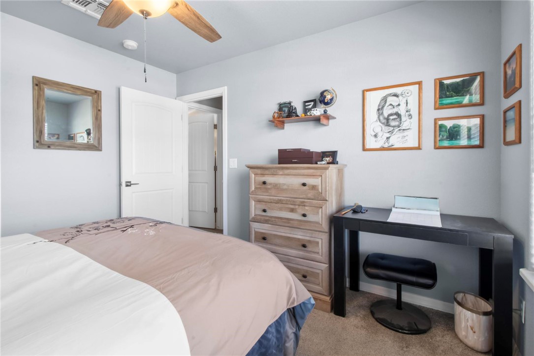 3897 Easy Street Kingman, AZ 86409 - Photo 26 of 53 a bedroom with a bed and a desk