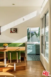 a kitchen with a sink and a large window