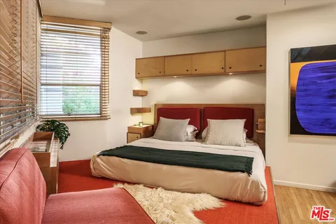 a bathroom with a bathtub and a window