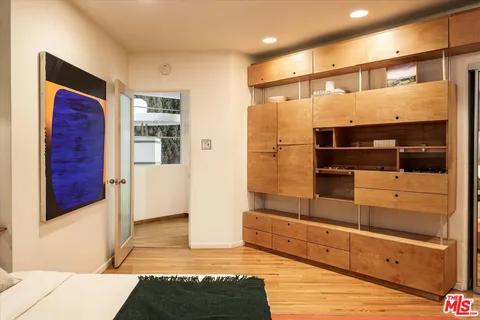 a bathroom with a shower and a sink