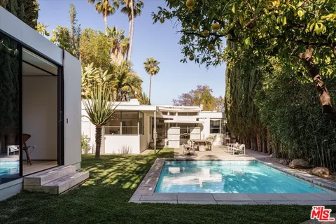 a view of swimming pool with a yard