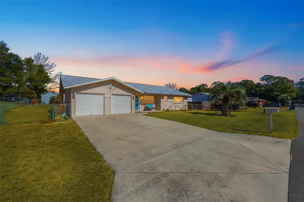 a house view with a garden space