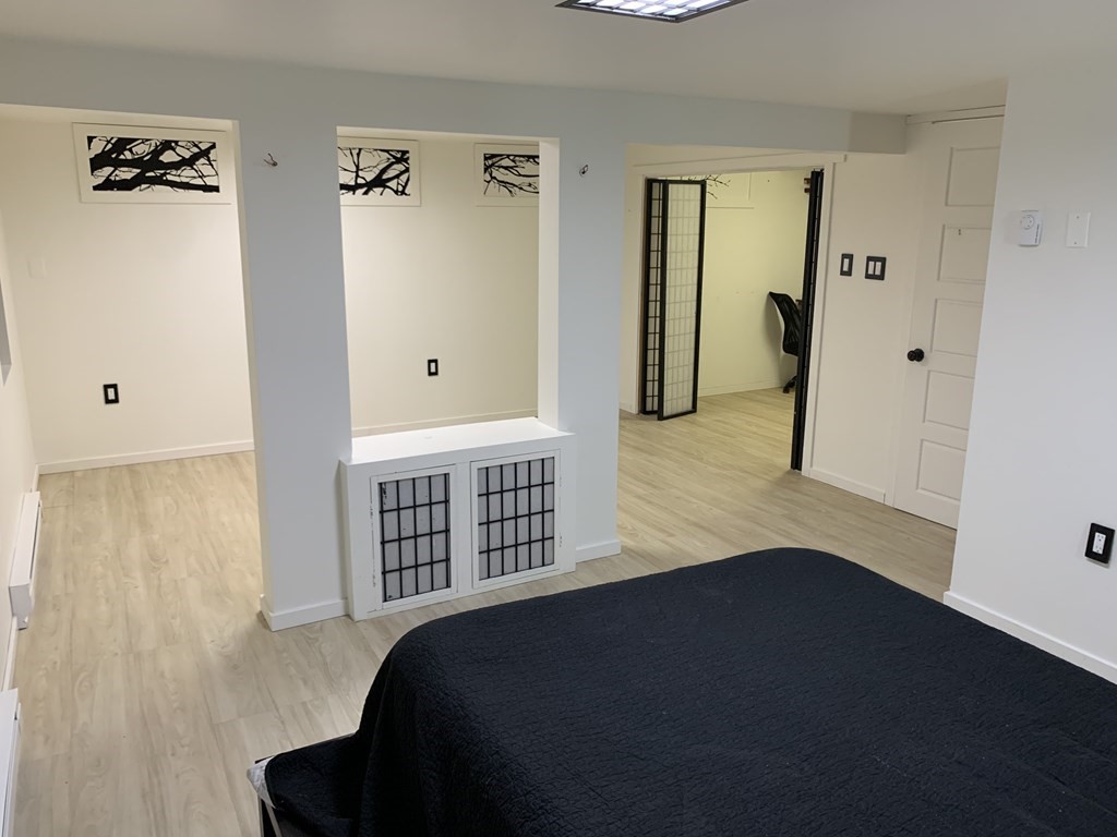 525 East County Road Rutland, MA 01543 - Photo 17 of 29 a bedroom with a bed and wooden floor