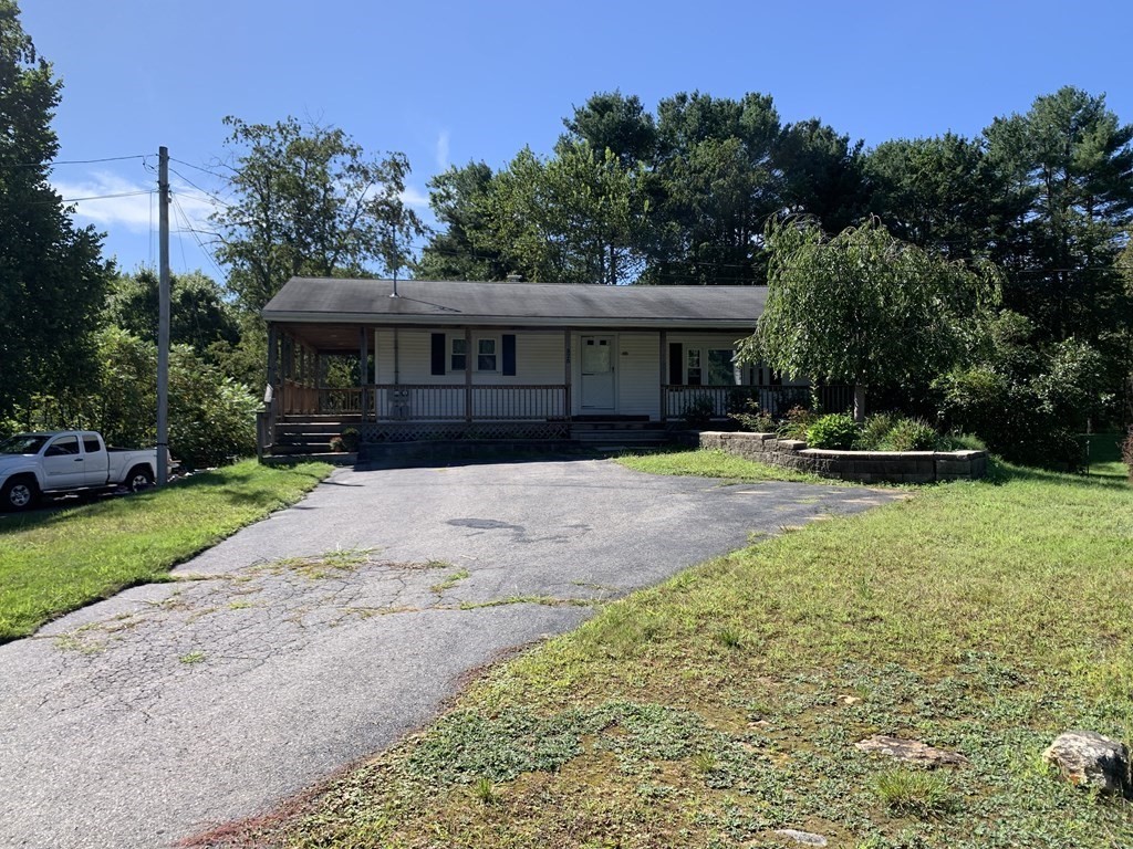 525 East County Road Rutland, MA 01543 - Photo 2 of 29 a front view of a house with a yard and trees