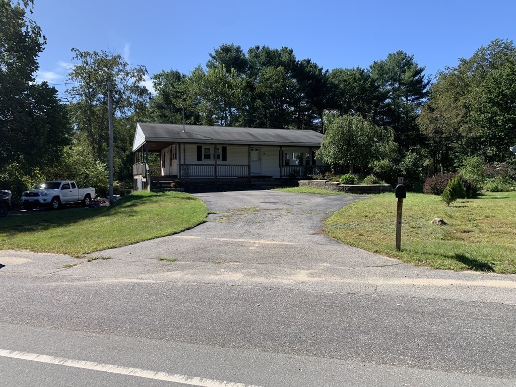 525 East County Road Rutland, MA 01543 - Photo 4 of 29 a front view of a house with a garden and trees