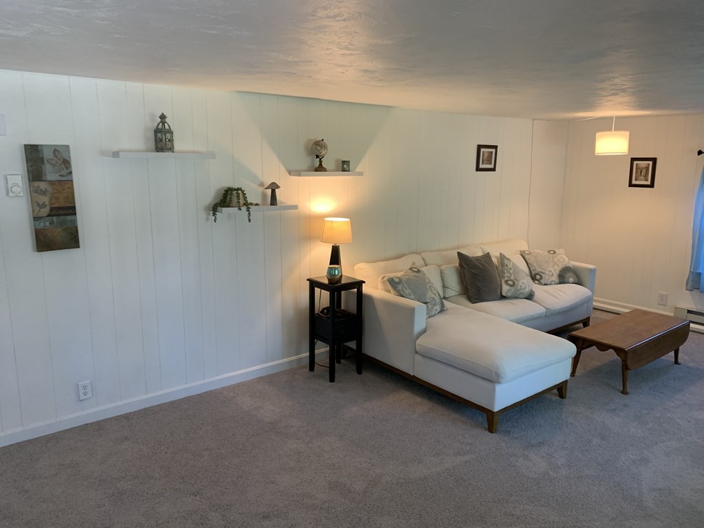 525 East County Road Rutland, MA 01543 - Photo 10 of 29 a living room with furniture and a wall painting