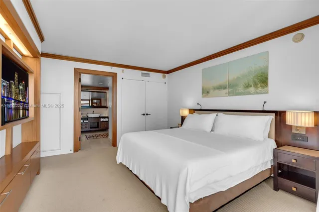 a bedroom with a bed and a walk in closet