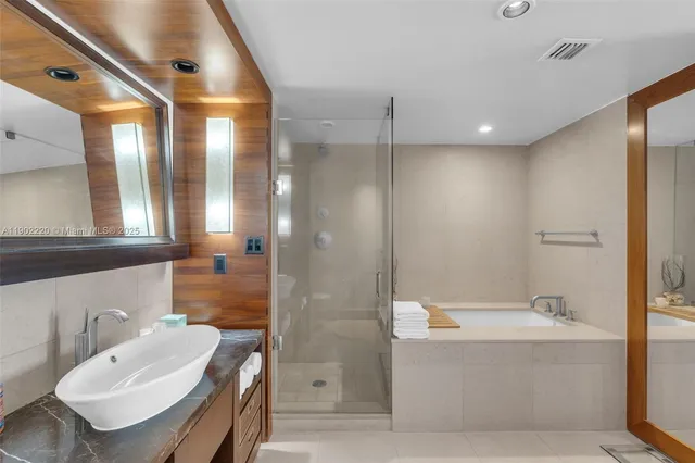 a bathroom with a bathtub and a sink