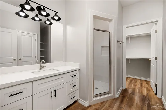 a bathroom with a sink a vanity and a mirror