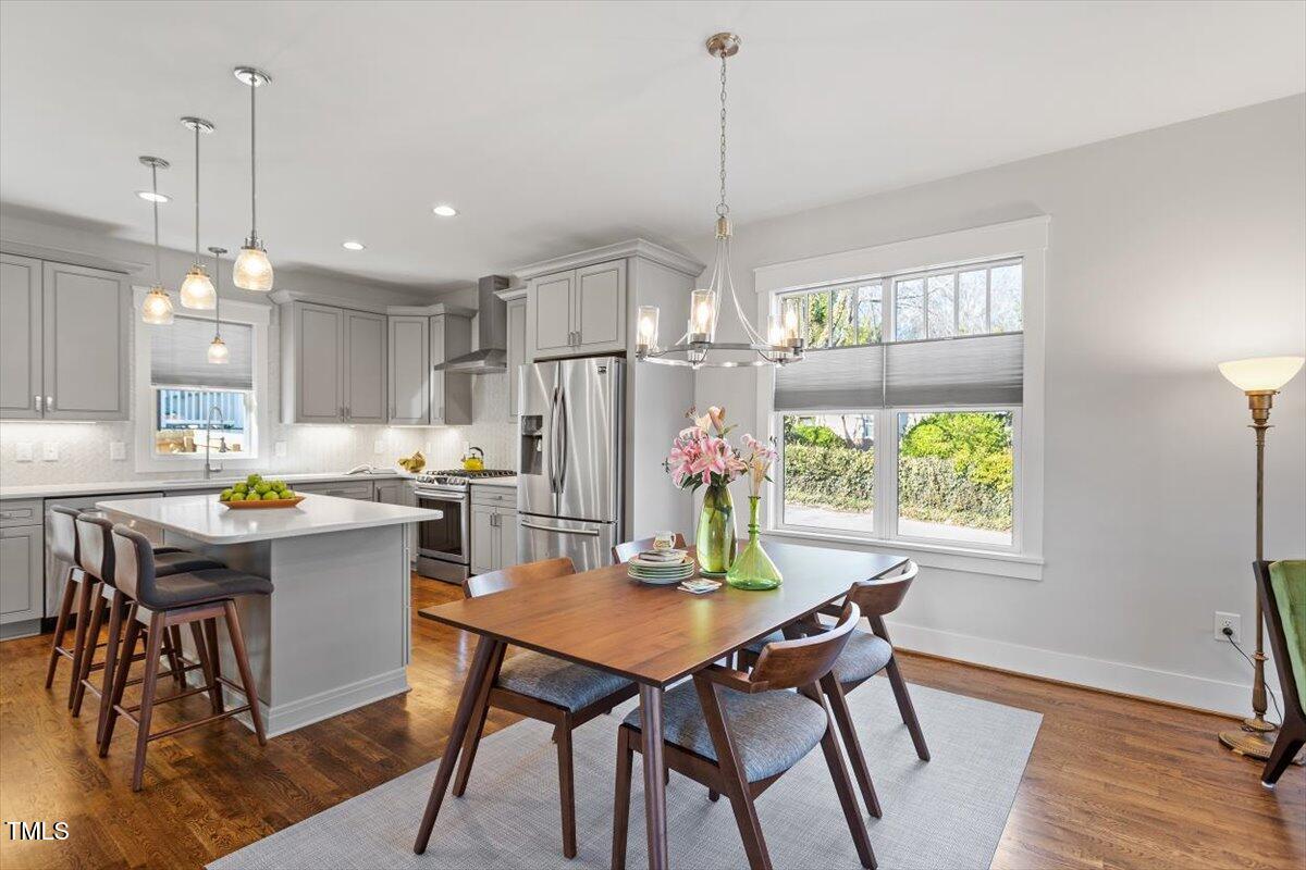 700 Coleman Street Raleigh, NC 27610 - Photo 11 of 44 a view of a dining room with furniture window and wooden floor