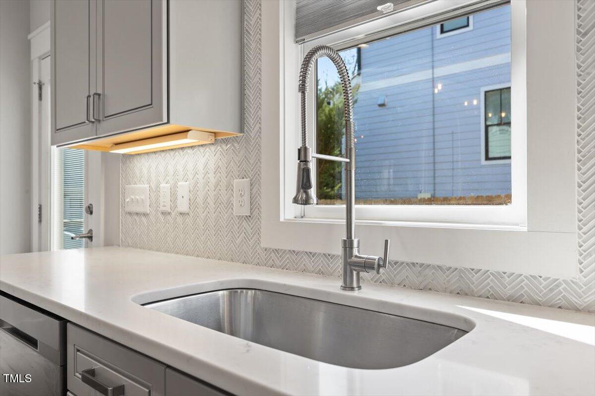 700 Coleman Street Raleigh, NC 27610 - Photo 17 of 44 a kitchen with a sink and a window