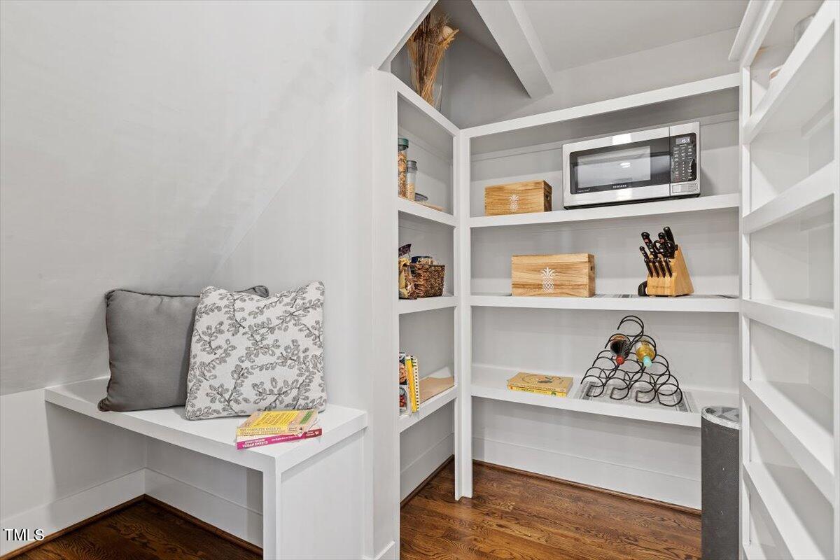 700 Coleman Street Raleigh, NC 27610 - Photo 18 of 44 a workspace with furniture and book shelf