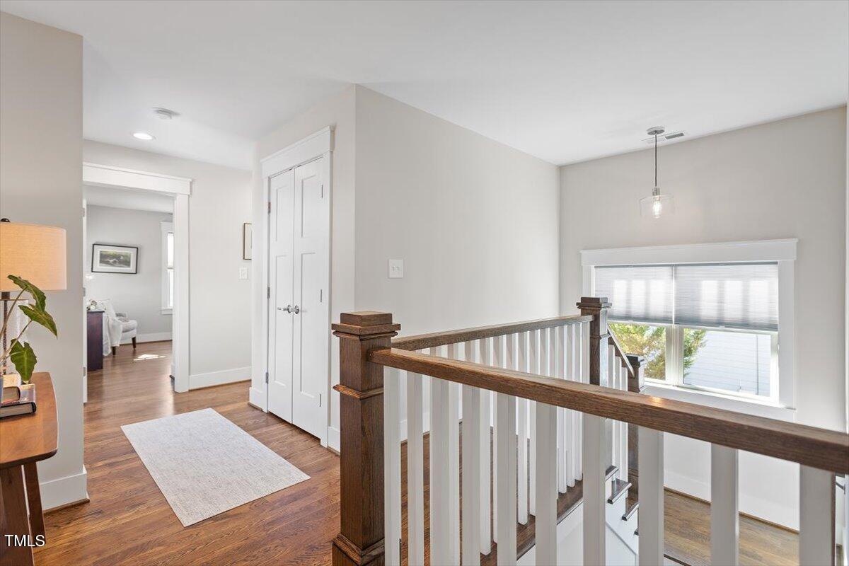 700 Coleman Street Raleigh, NC 27610 - Photo 24 of 44 a view of hallway with wooden floor and windows