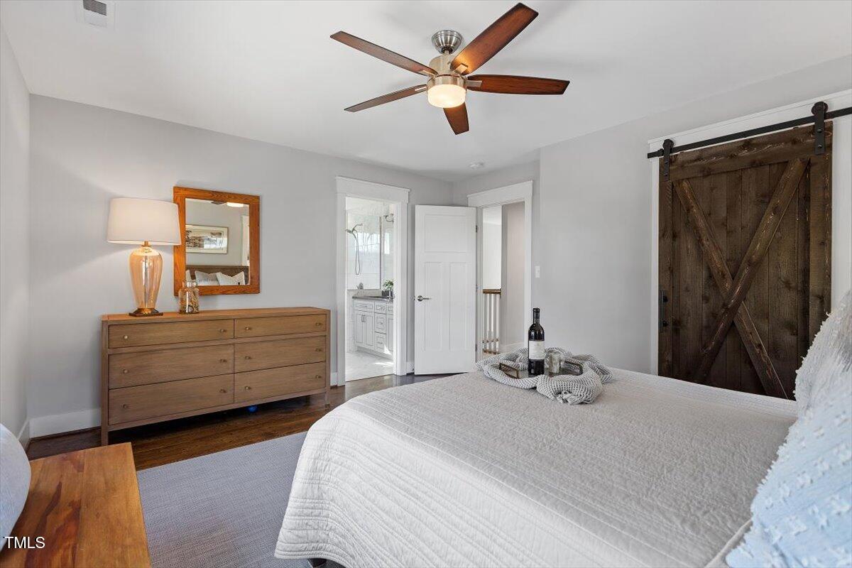 700 Coleman Street Raleigh, NC 27610 - Photo 27 of 44 a bedroom with a bed and a dresser