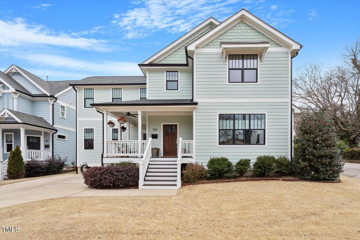 700 Coleman Street Raleigh, NC 27610 - Photo 3 of 44 a view of a house with large windows and plants