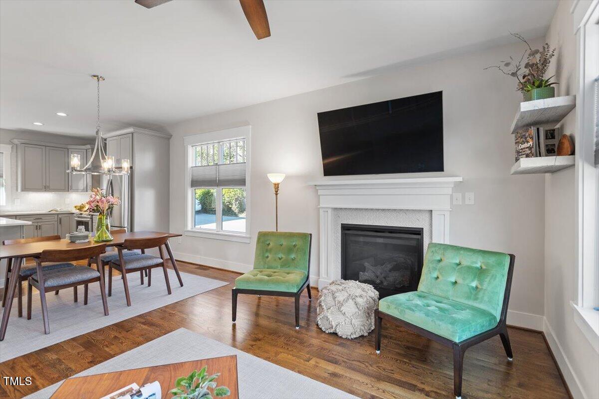 700 Coleman Street Raleigh, NC 27610 - Photo 9 of 44 a living room with furniture a flat screen tv and a fireplace