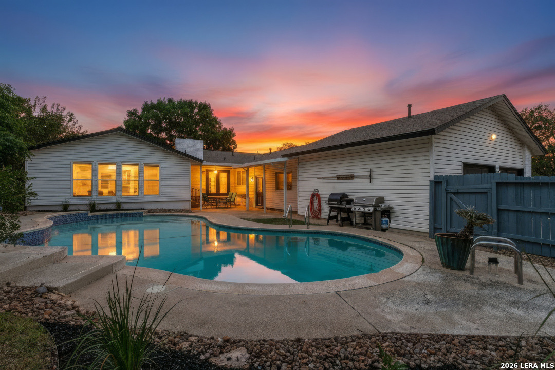 102 Silver Spring Universal City, TX 78148 - Photo 1 of 36 a front view of a house with swimming pool having outdoor seating