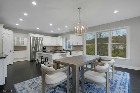 a kitchen with a table and chairs