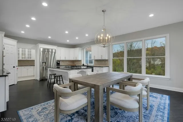 a kitchen with a table and chairs
