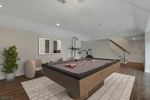 a living room with furniture and potted plant