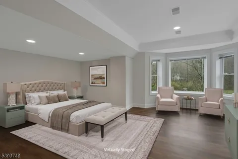 a bedroom with a large bed and a couch