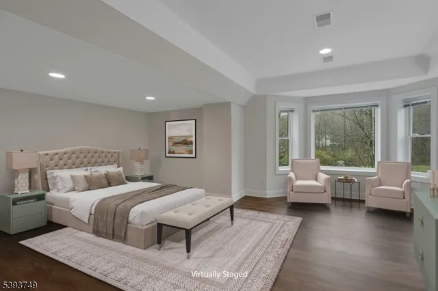 a bedroom with a large bed and a couch