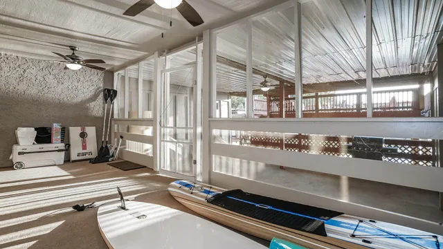 a view of a balcony with two chairs