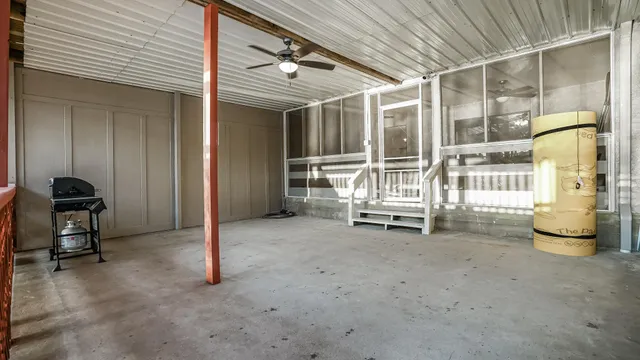 a view of a balcony with wooden floor and outdoor seating
