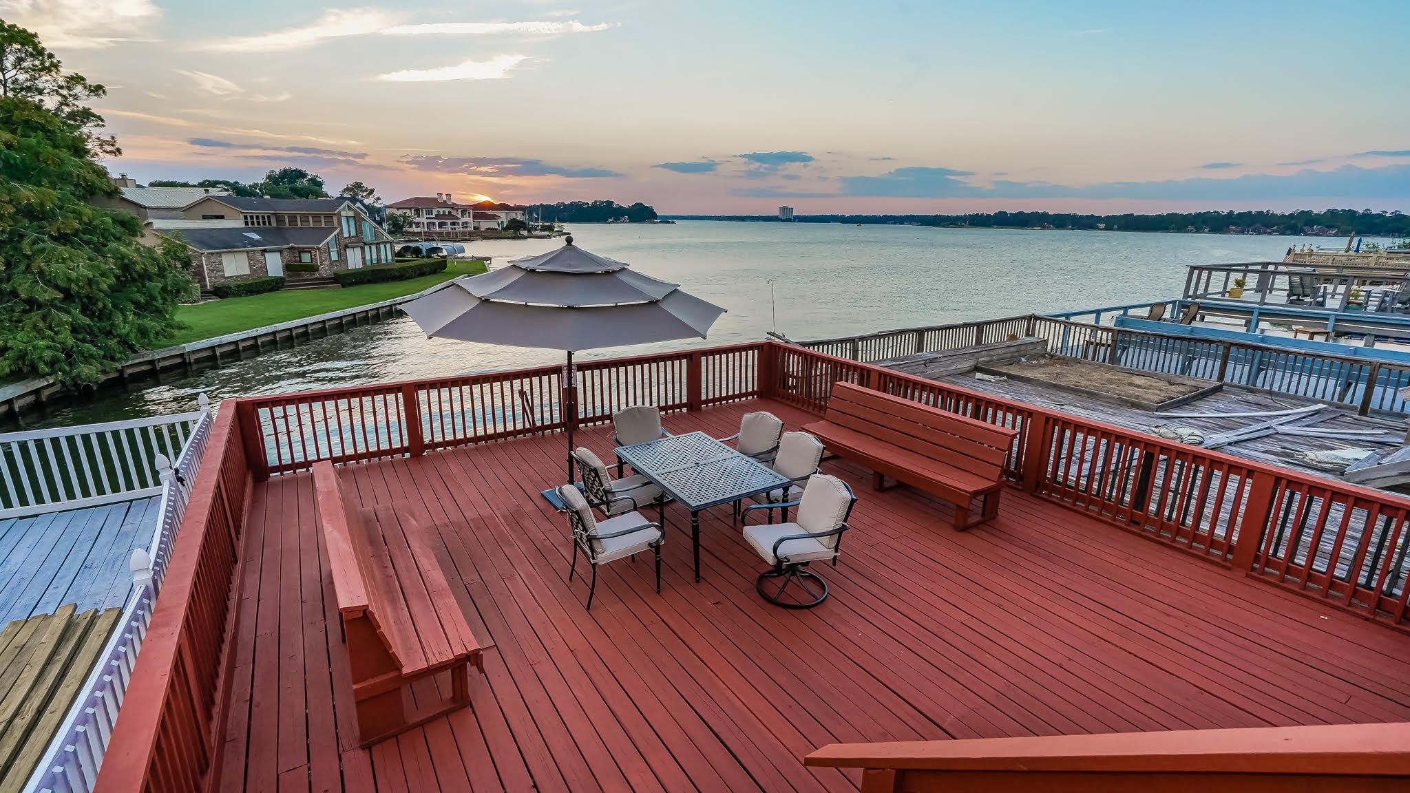129 Capetown Conroe, TX 77356 - Photo 29 of 35 a view of a balcony with wooden floor and outdoor seating