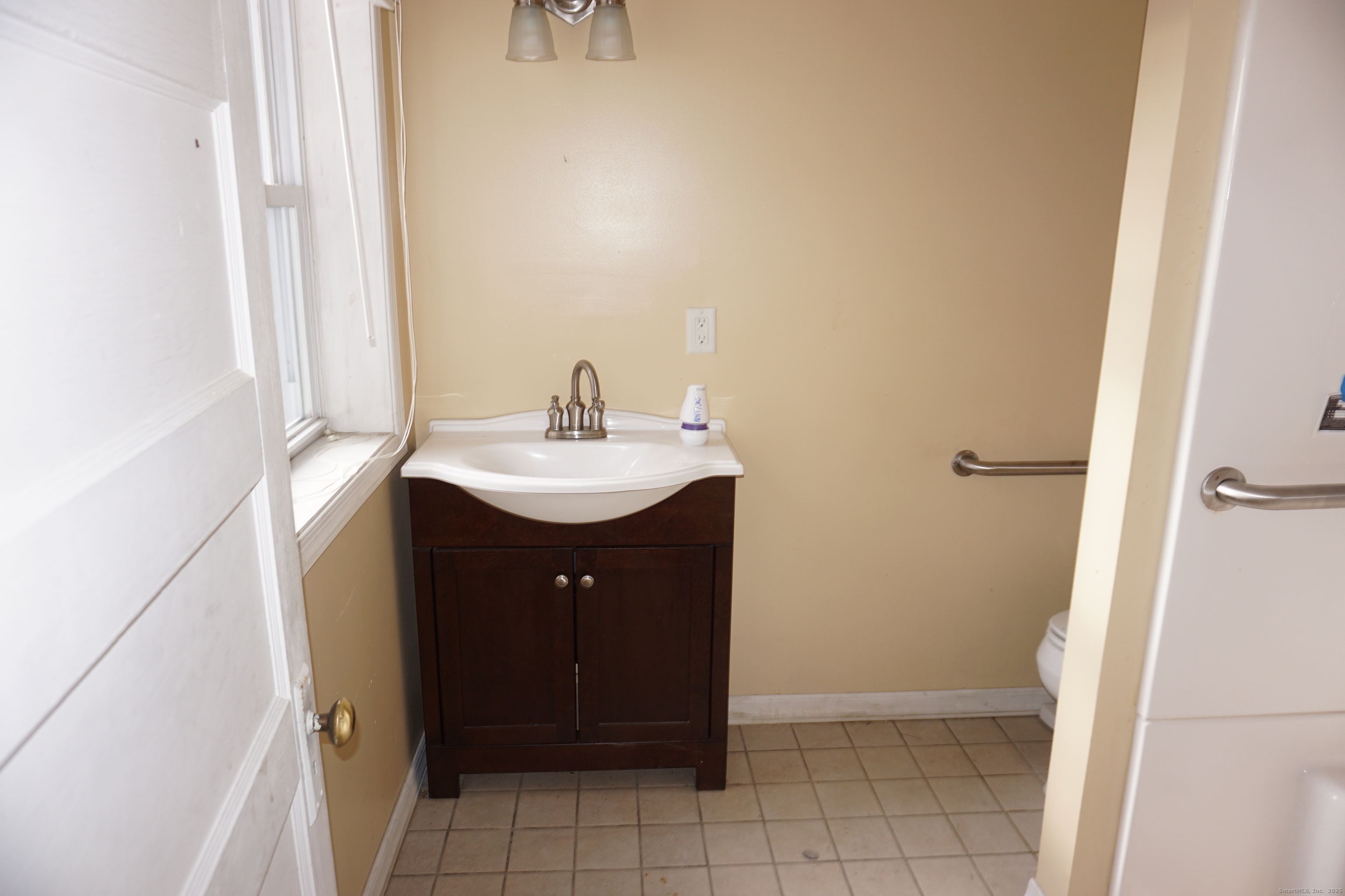 37 Franklin Street Ludlow, MA 01056 - Photo 13 of 22 a bathroom with a sink and a mirror