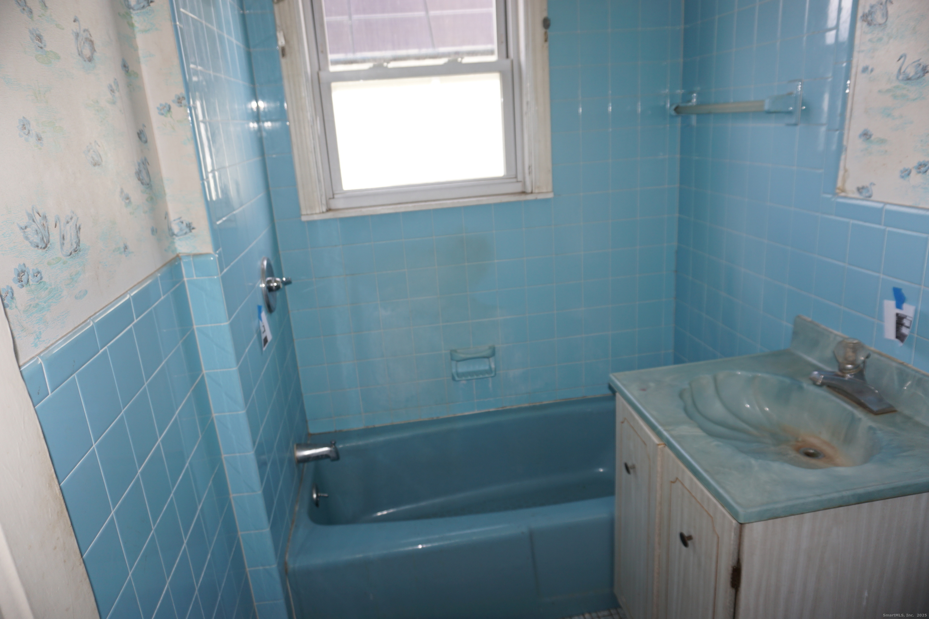 37 Franklin Street Ludlow, MA 01056 - Photo 14 of 22 a bathroom with a sink a toilet and shower