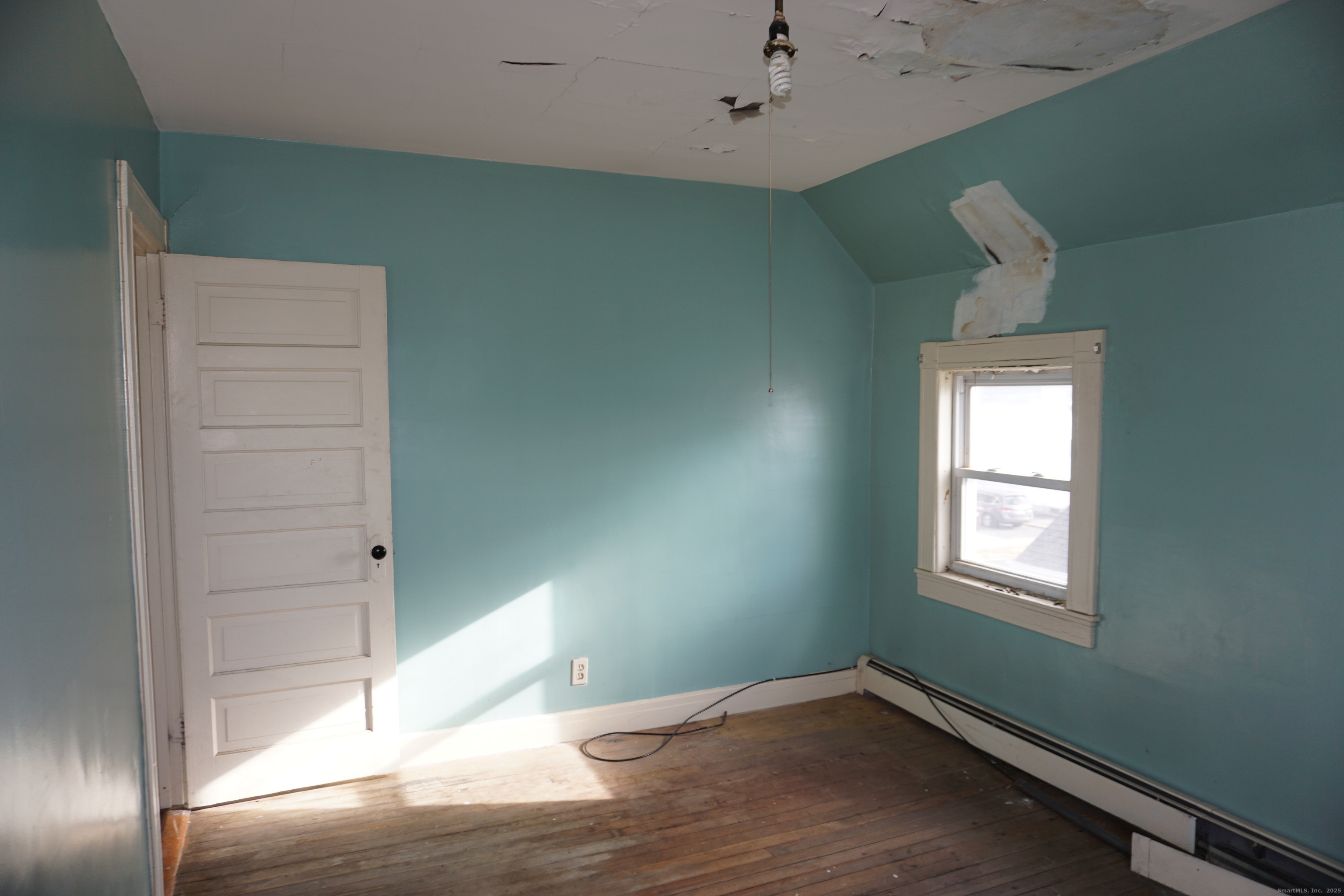 37 Franklin Street Ludlow, MA 01056 - Photo 15 of 22 an empty room with wooden floor and windows