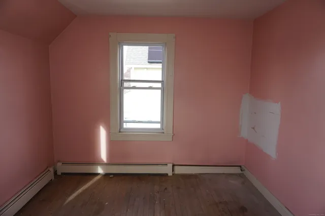 an empty room with a empty space and window