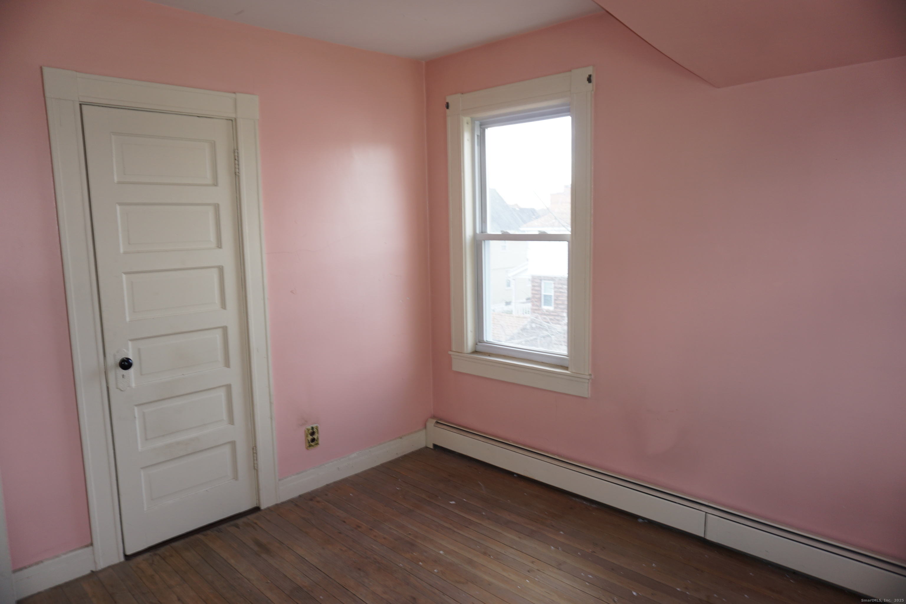 37 Franklin Street Ludlow, MA 01056 - Photo 18 of 22 an empty room with wooden floor and window