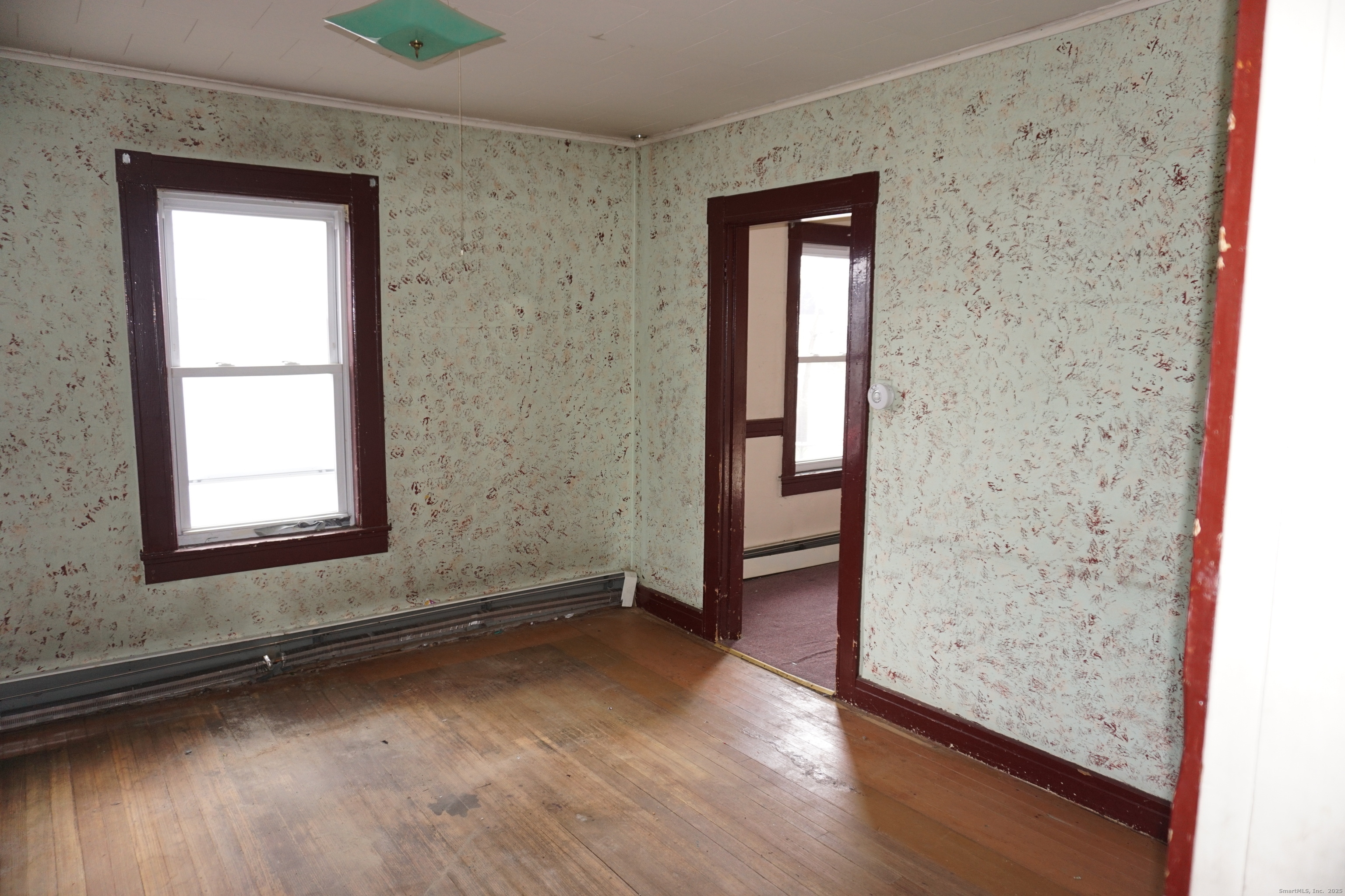 37 Franklin Street Ludlow, MA 01056 - Photo 9 of 22 an empty room with wooden floor closet and windows