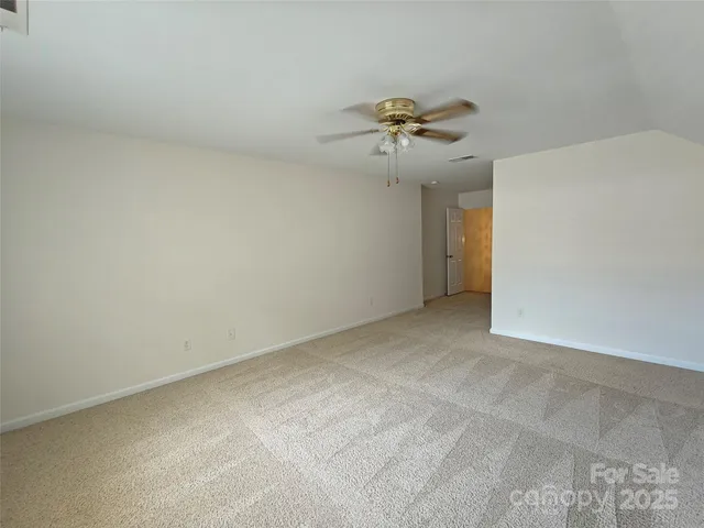 a view of a big room with carpet