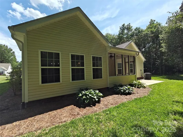 a view of a house with a garden