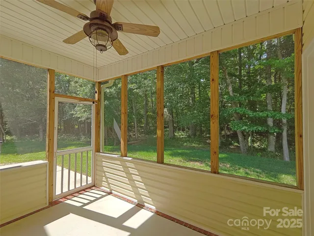 a view of a room with a large window