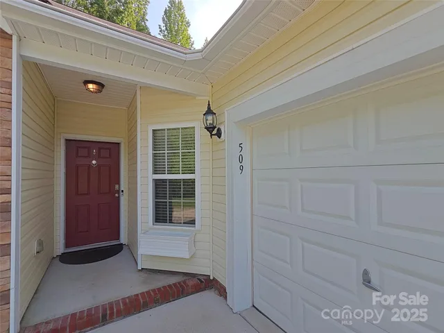 a view of front door and bedroom