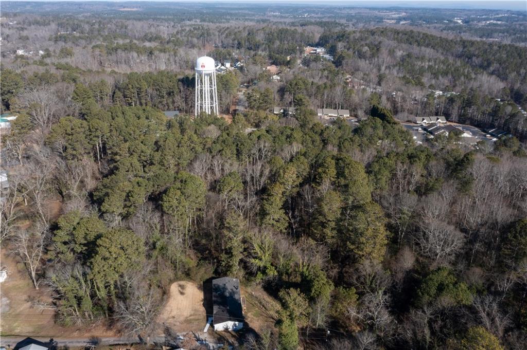 0 East Foster Avenue Dallas, GA 30132 - Photo 17 of 48 an aerial view of a houses with a lush green hillside