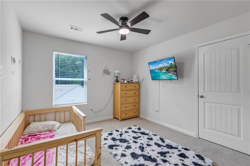 575 Walnut Grv Way Pendergrass, GA 30567 - Photo 19 of 39 a bedroom with furniture and a window
