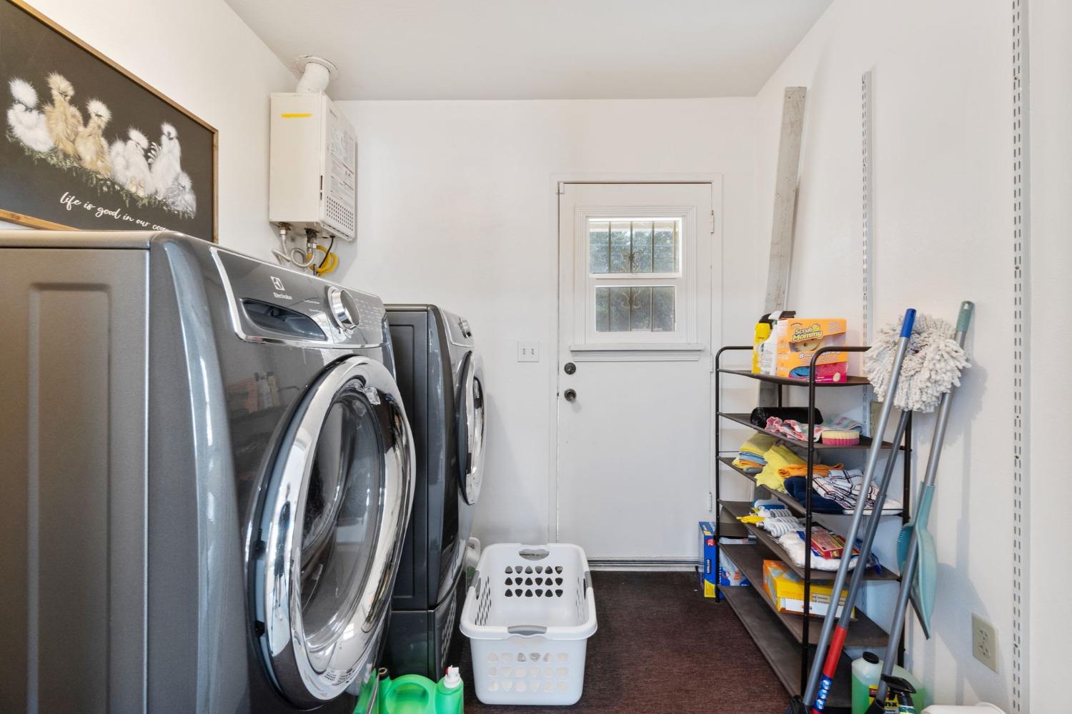 36264 Ave 12 Madera, CA 93636 - Photo 17 of 23 a view of a storage & utility room with fridge and toys