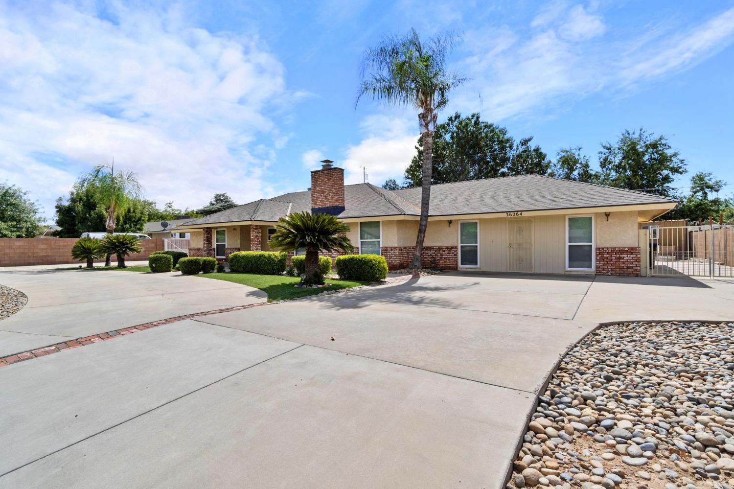 36264 Ave 12 Madera, CA 93636 - Photo 2 of 23 front view of a house with a street