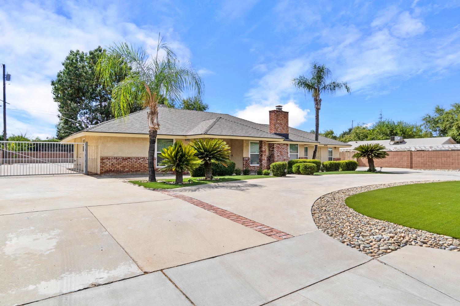 36264 Ave 12 Madera, CA 93636 - Photo 3 of 23 a front view of a building with garden