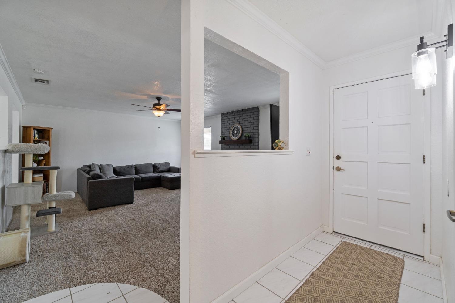 36264 Ave 12 Madera, CA 93636 - Photo 5 of 23 a living room with furniture and a rug