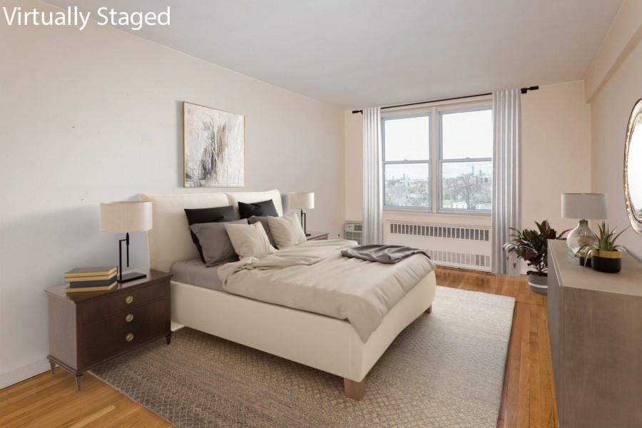 8301 Ridge Boulevard, Unit 6F Brooklyn, NY 11209 - Photo 13 of 24 a bedroom with a bed and a couch