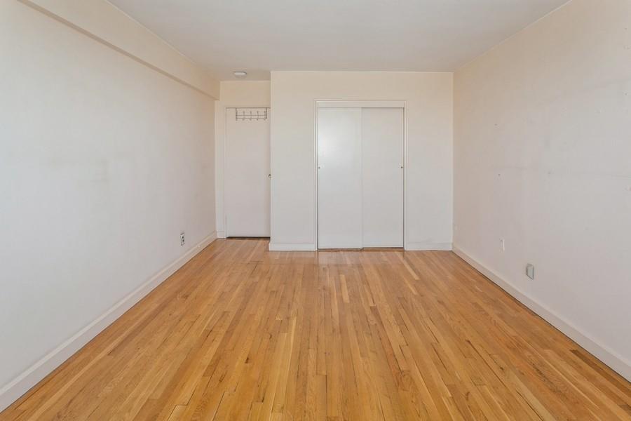8301 Ridge Boulevard, Unit 6F Brooklyn, NY 11209 - Photo 15 of 24 a view of a room with wooden floor and white walls