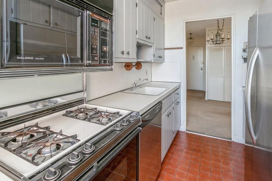 8301 Ridge Boulevard, Unit 6F Brooklyn, NY 11209 - Photo 17 of 24 a kitchen with stainless steel appliances granite countertop a sink stove and refrigerator