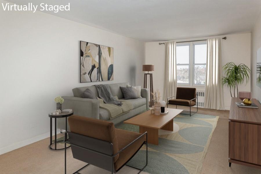 8301 Ridge Boulevard, Unit 6F Brooklyn, NY 11209 - Photo 5 of 24 a living room with furniture and a large window